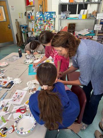 Students in classroom with artist